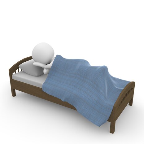 Grafik: 3-D-Männchen schläft in einem Bett.